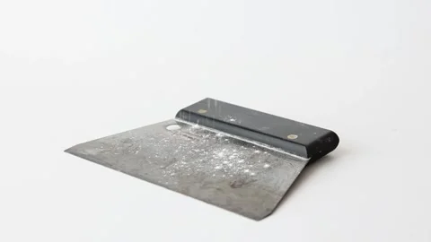 Flour falling on bread dough scraper slow motion Stock Footage 196000273