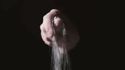 Flour falling from hand. Close-up of making and prepares flour for homemade Stock-Footage 131236999