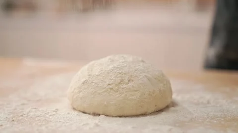 Flour falls on the dough Stock Footage 273500488