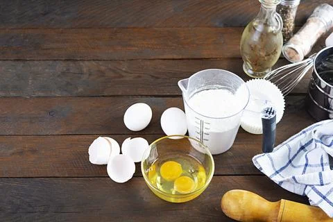 Flour with kitchen accessories for making dough. Dough for baking. Stock Photos