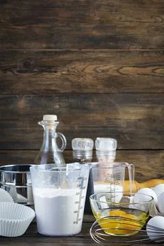 Flour with kitchen accessories for making dough. Dough for baking. Stock Photos
