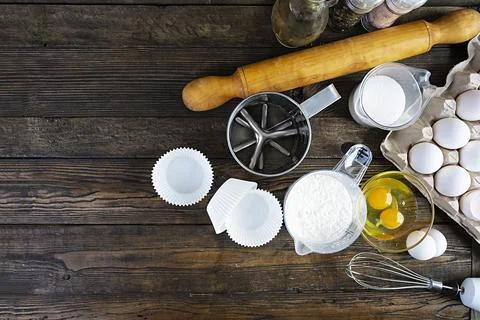 Flour with kitchen accessories for making dough. Dough for baking. Stock Photos