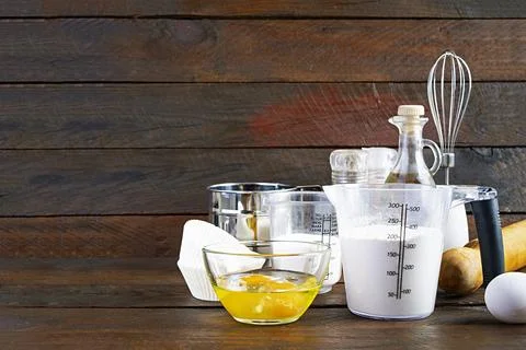 Flour with kitchen accessories for making dough. Dough for baking. Stock Photos