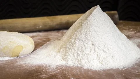 Flour on the kitchen table Stock Photos