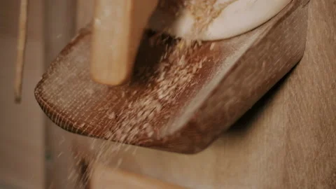 Flour mill dropping processed grain into a bin Stock Footage 130337095