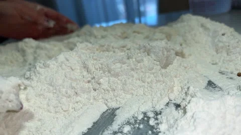 Flour is mixed with the hands Stock Footage 221201835