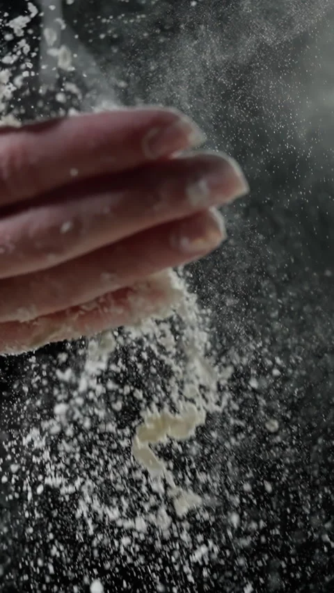 Flour particles dispersing dynamically after baker's hand clap, powdery cloud Stock Footage 301647860