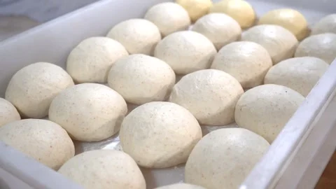 Flour pies on a baking sheet before baking Stock Footage 321826834