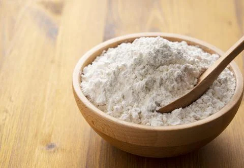 Flour placed on a wooden background Stock Photos