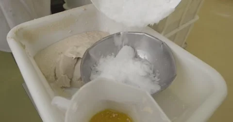 Flour Pours Into A Bowl Of Egg Mixture During Baking Видео 340263147