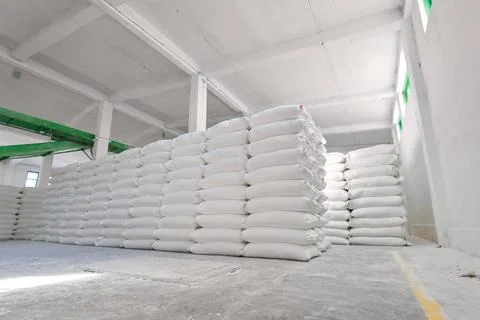 Flour sack storage facility filled with neatly stacked bags in a spacious Stock Photos