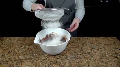 Flour sieving slow motion Stock Footage 150277987