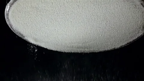 Flour sift flat sieve, black background. Slow motion, bottom view Stock Footage 75486845
