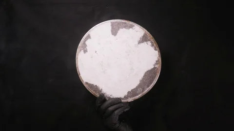 Flour sift through sieve on black background Stock Footage 108685521