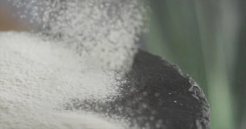 Flour sifted on flour on a black surface Video stock 198560948