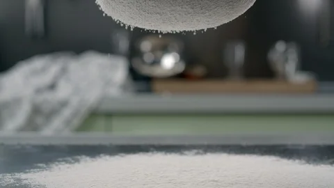 The flour is sifted through the sieve, making the dough, cooking pastry, baking Stock Footage 119255111