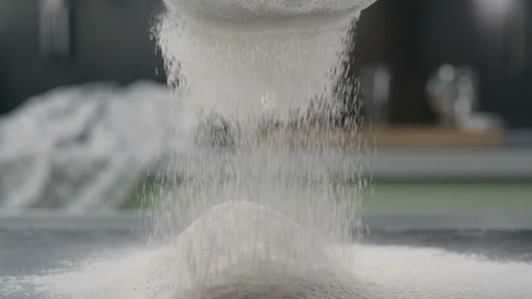 The flour is sifted through the sieve, making the dough, cooking pastry, baking Stock Footage 119304008