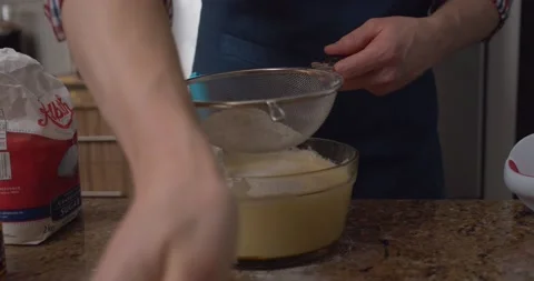 Flour sifter hands batter Stock Footage 147299156