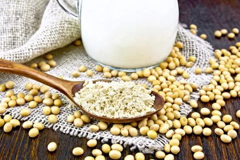 Flour soy in spoon on sacking Stock Photos