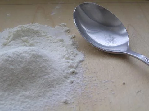 Flour with a spoon Stock Photos
