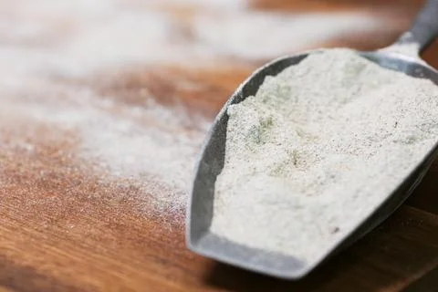 Flour on a spoon Stock Photos