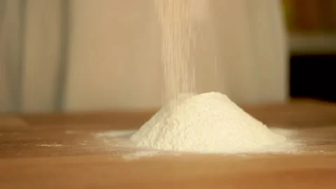 Flour sprinkles on table make hill for dough bake Stock Footage 131161327
