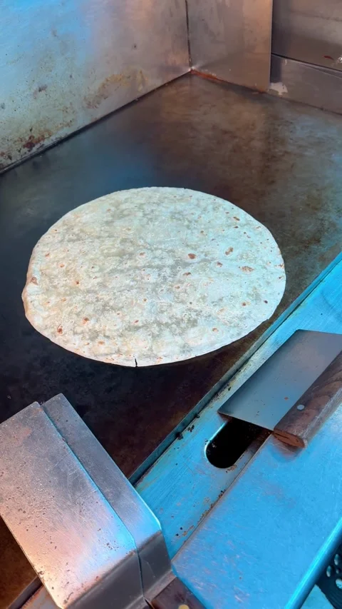 Flour Tortilla Heating on Griddle Stock Footage 318749331