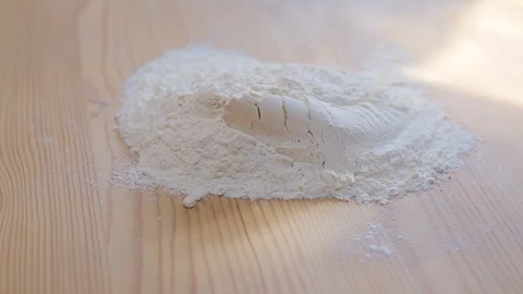 Flour on a wood table Stock Footage 128294412