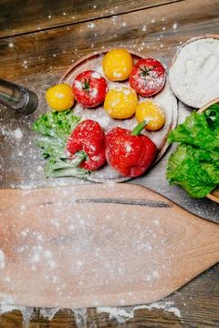 Floured vegetables on kitchen table. dirty work surface while cooking Fotos de archivo