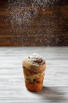 The flourished cookie is on the grey table. Stock Photos