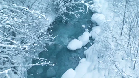 Flow of the Biei River in the Snow Video stock 332375442