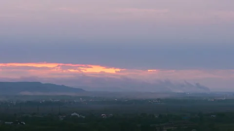  The flow of cloud against the sunset over the city. Time lapse Stock Footage 62744922