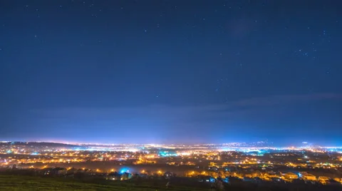 The flow of cloud on a background of the night city. Time lapse. Wide angle Stock Footage 61759386