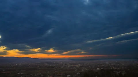 Flow of cloud over the city on the background of sunset. Time lapse. Wide angle Vídeos de archivo 61423685