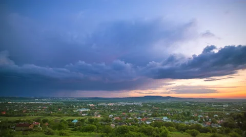 The flow of cloud over the evening city. Time lapse Video stock 62921087
