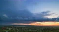 The flow of cloud over the evening city. Time lapse 4k or 4k+ Resolution