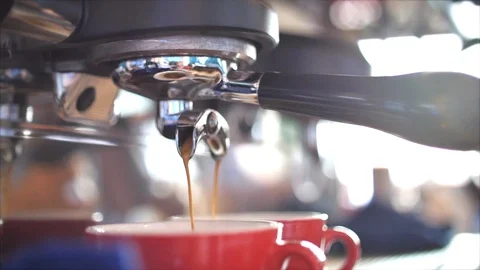 Flow Coffee stream from professional machine in cup. Profeshional machine making Stock Footage 126365358