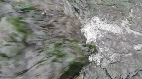 FLOW OF A COLD MOUNTAIN RIVER IN AUTUMN Stock Footage 129078608