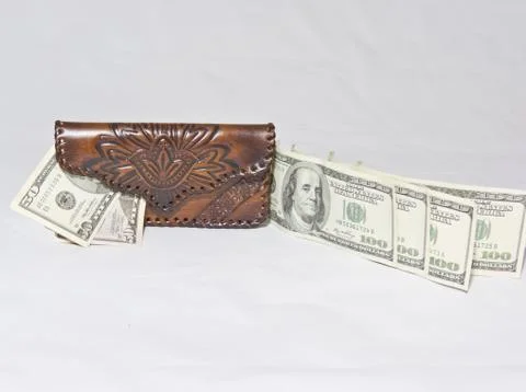 The flow of dollars to the purse Stock Photos