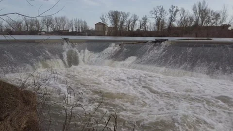 Flow of the Duero river at a small dam in San Miguel del Pino, Valladolid Stock Footage 238852617
