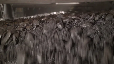 Flow of fine coal flowing through the vibrator Stock Footage 205219253