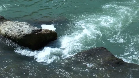 The flow of the mountain river down with rocky rapids. Stock Footage 117425729