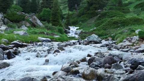 Flow of a Mountain River on Rocky Slope Stock Footage 249754394