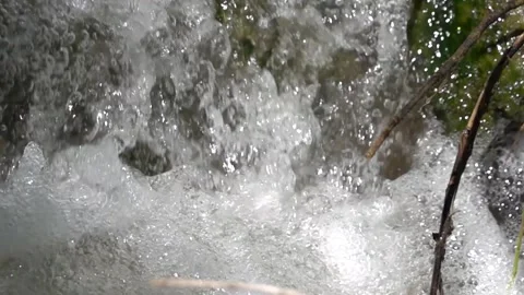 Flow of a mountain stream in nature in slow motion Stock Footage 310210366