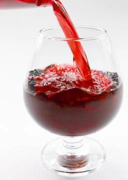 Flow patterns of red wine Stock Photos