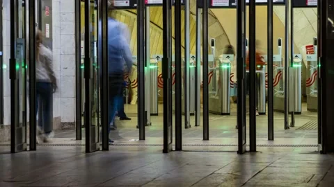 The flow of people passing through the  doors of the metro station, time laps Stock Footage 137920797