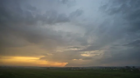 The flow of rain cloud over the city on the background of sunset. Time lapse Stock Footage 62258409