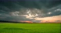 The flow of rain cloud over the city on the background of sunset 4k or 4k+ Resolution