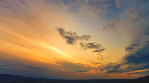 The flow of rain cloud on the sunset background. Time lapse. Wide angle Stock Footage 61736291