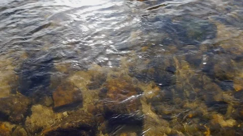 The flow of a river over rocks round mountain Video stock 91900529